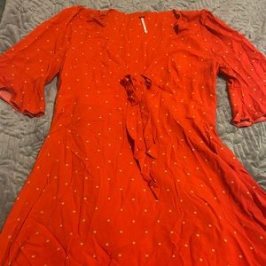 Orange and yellow polka dot free people mini dress. Deep V.